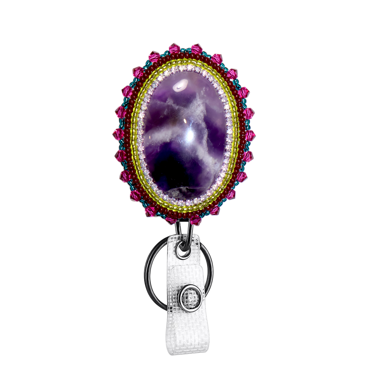 A beaded oval badge reel featuring a purple amethyst cabochon in the center, surrounded by a gold beaded border and pink and blue bead accents, with a white textured strap and silver metal ring.
