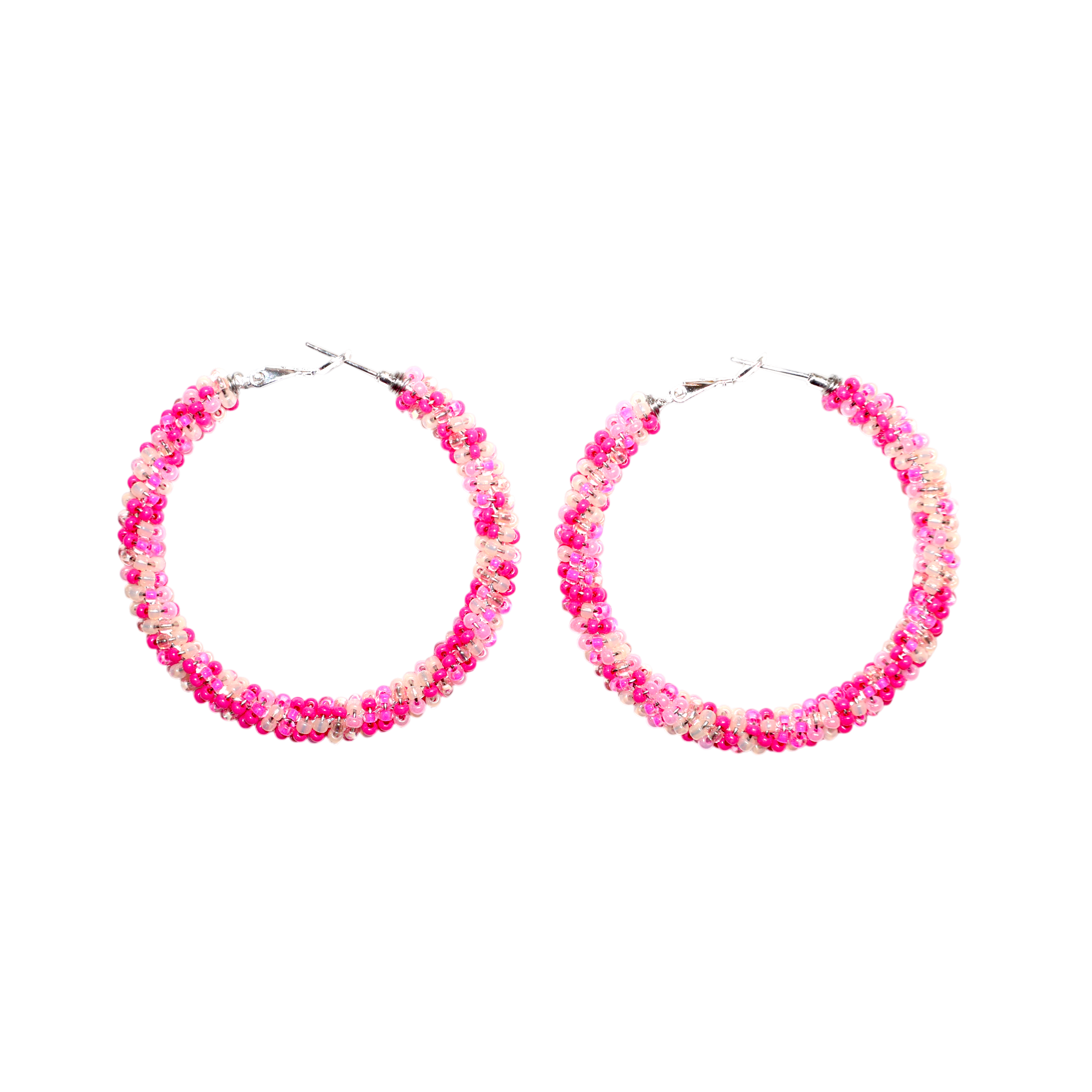 A pair of large hoop earrings decorated with dense clusters of small pink and white flowers, shown on a plain white background.