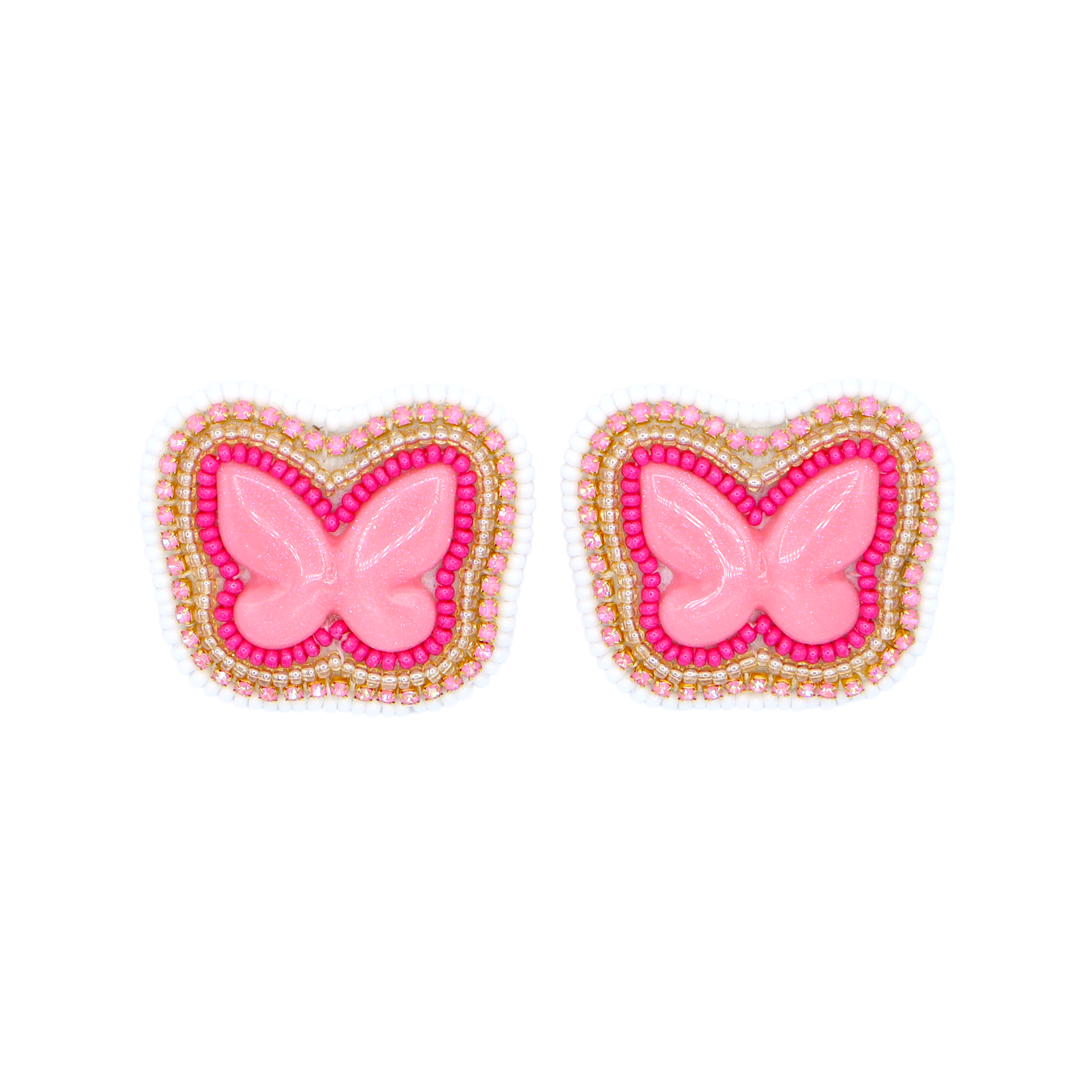 A pair of butterfly-shaped embellishments with a glossy pink center, surrounded by a border of pink and white beads with gold metallic accents, set against a plain white background.
