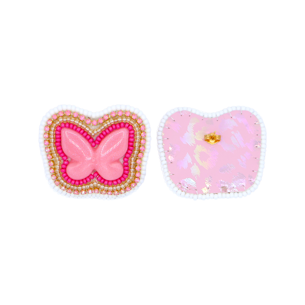 Two decorative embellishments on a white background: a butterfly-shaped earring with pink center and gold/red beaded border, and a heart-shaped patch with pink glitter and a small gold butterfly detail.