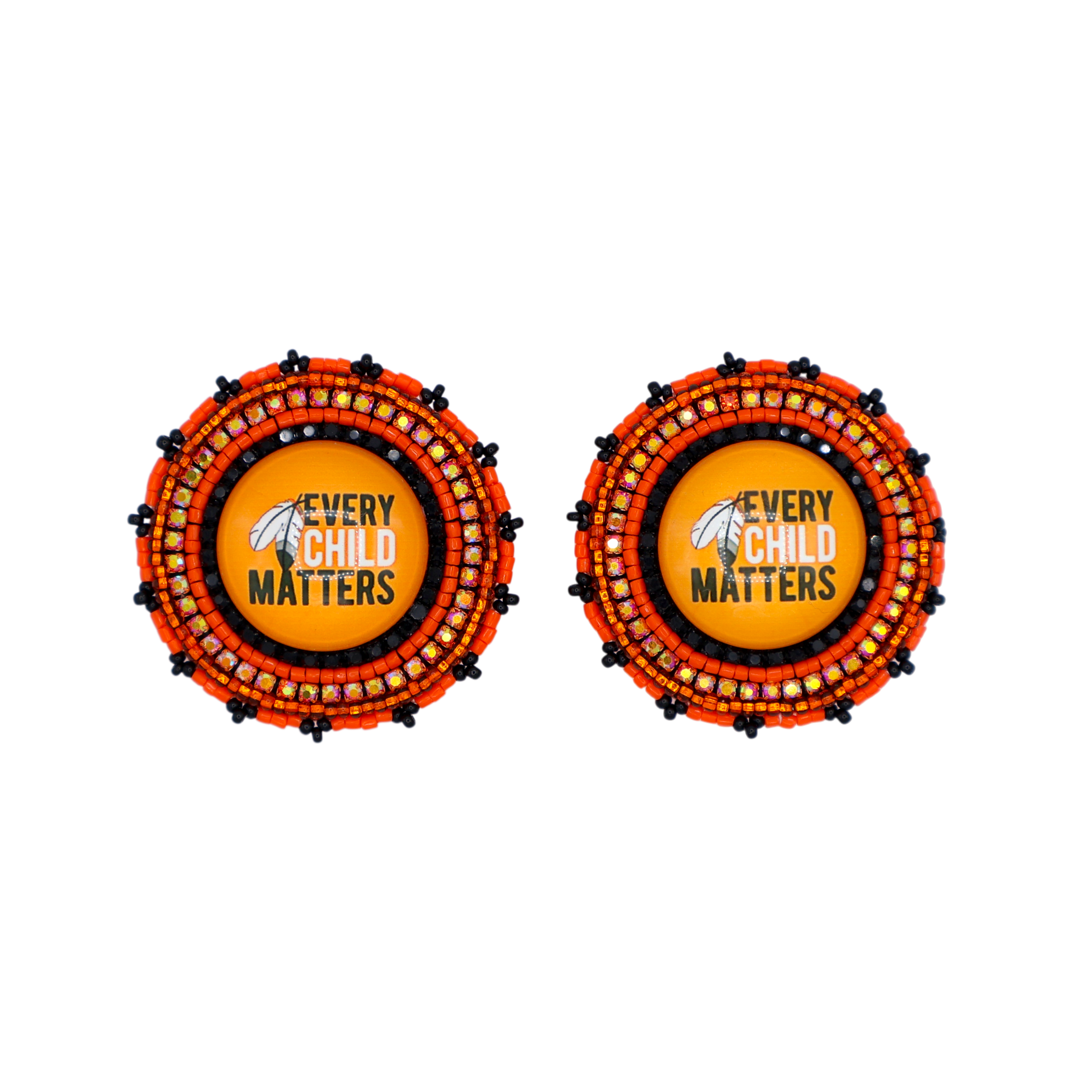Two circular patchwork earrings on a plain white background. Each earring features a central yellow circle with a black and white bird logo and the text 'EVERY CHILD MATTERS' in black.