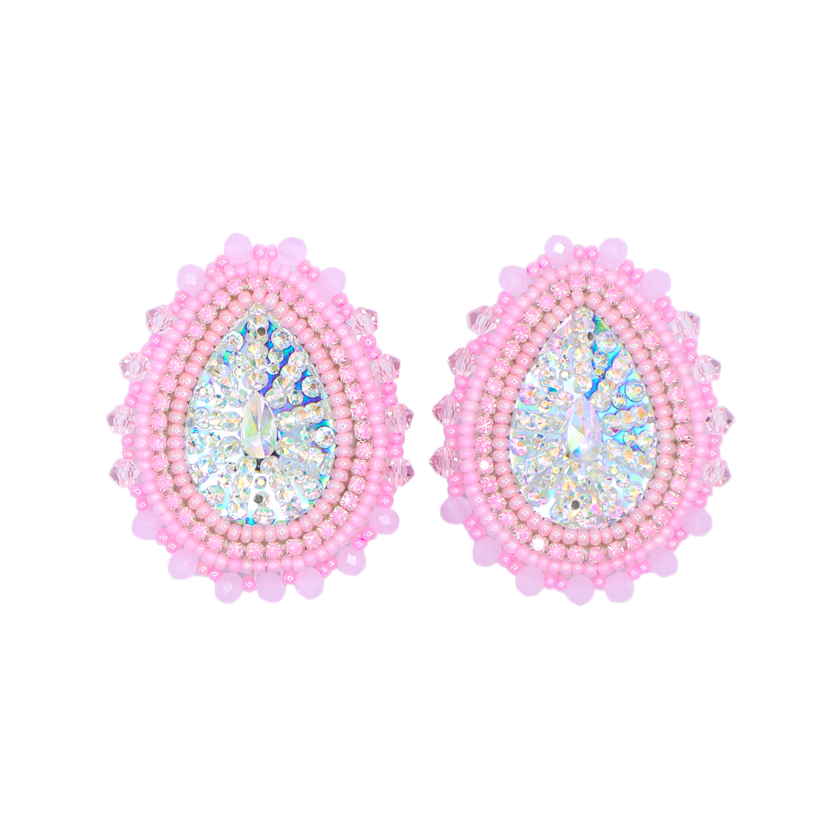 A pair of teardrop-shaped earrings with iridescent blue and white faceted center stones, surrounded by rows of light pink beads, on a solid white background.