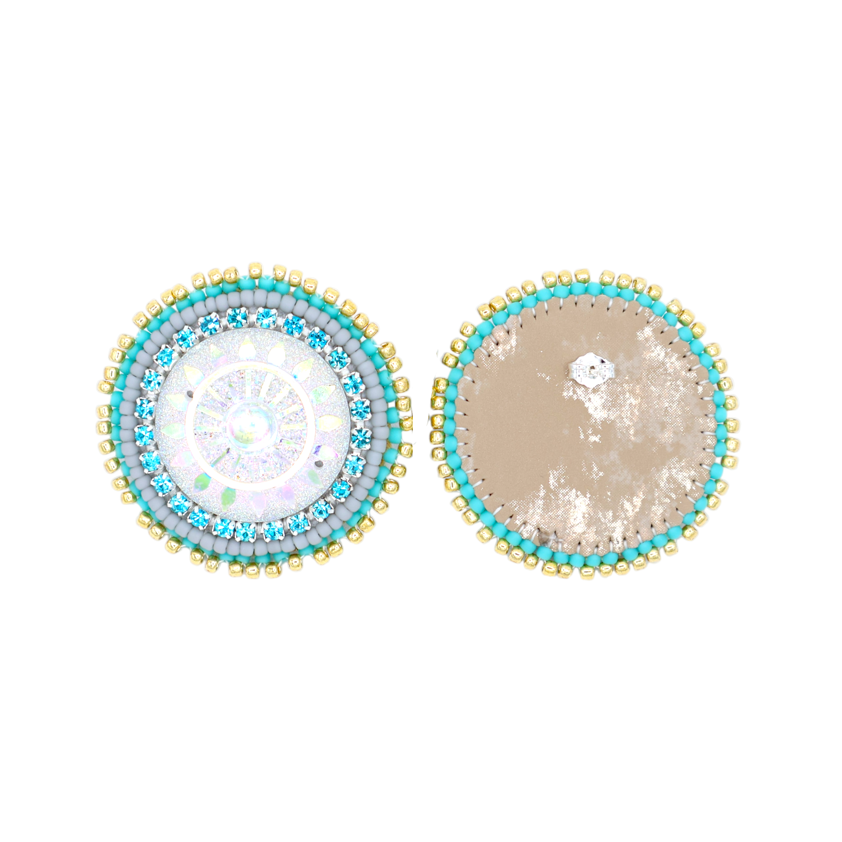 Two round beaded earrings shown from the top on a plain white background. One earring has a multicolor iridescent center with blue, green, and gold beads, and the other has a textured beige center with a small white dot, both bordered by turquoise and gold beads.