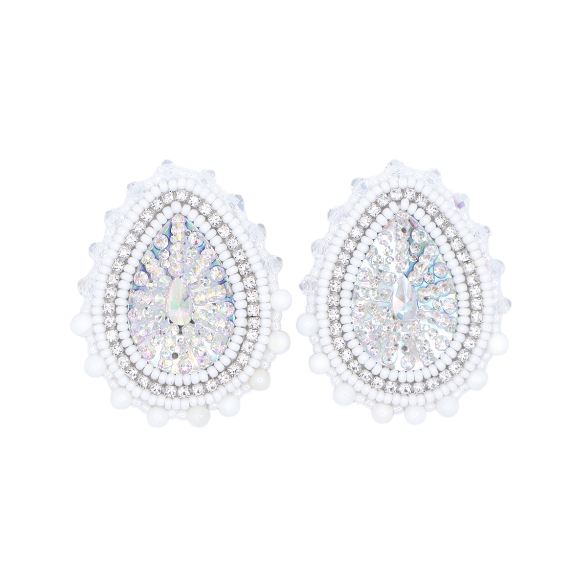 A pair of teardrop-shaped stud earrings with iridescent center stones surrounded by clear rhinestones and a border of white faux pearls, set against a plain white background.