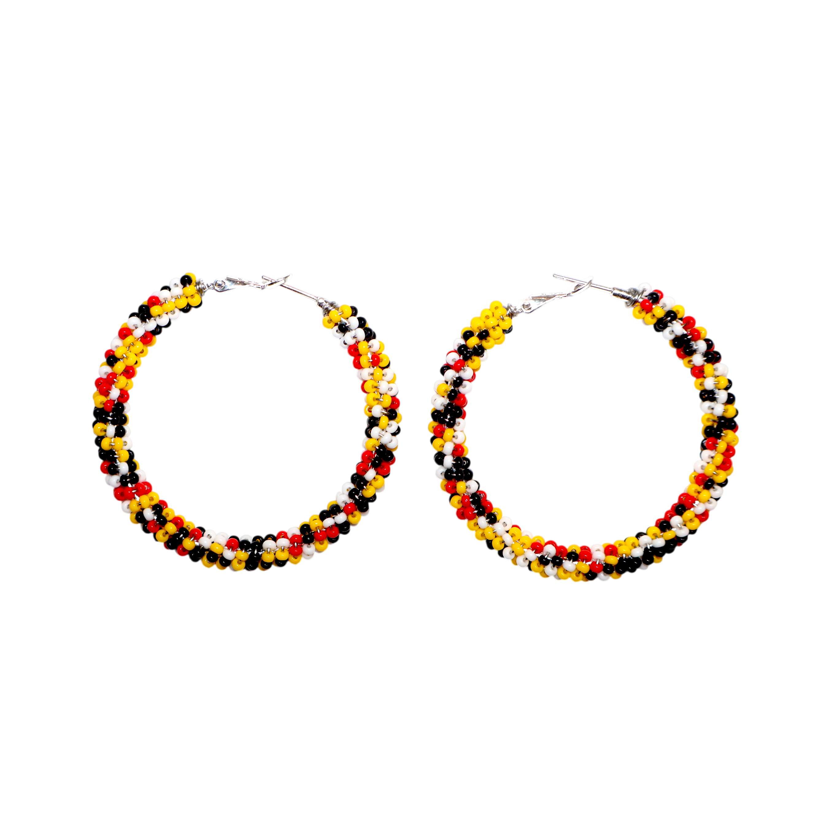 A pair of large hoop earrings made from small beads in black, yellow, orange, and white, arranged in horizontal stripes, shown on a plain white background.